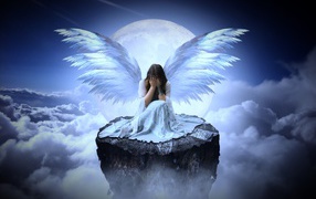 Girl with angel wings sits on a stone in the clouds