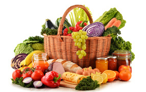 Basket with vegetables and food on a white background