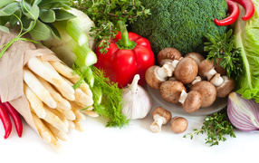 Fresh vegetables with mushrooms on a white background