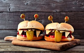 Funny burgers on a cutting board