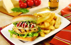 Hamburger on a plate with french fries