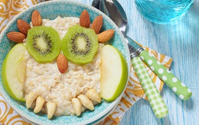 Oatmeal with nuts, kiwi and apples for a child