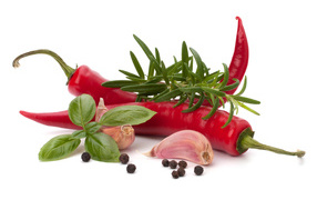 Red pepper with garlic, basil, black pepper and rosemary on a white background