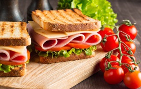 Sandwiches on the table with tomatoes and lettuce