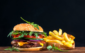 Tasty burger on the table with french fries