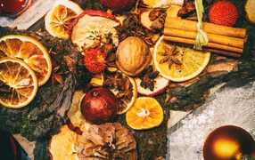 Dried fruits, nuts and fir cones on the table