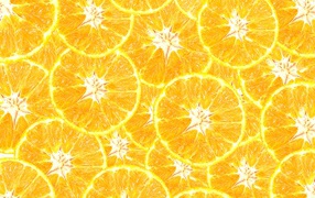 Оранжевый фон из кусочков апельсина крупным планом