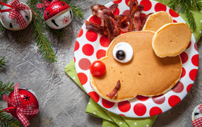 Pancakes on a plate with bacon for the new year