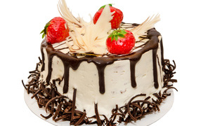 Appetizing cake decorated with chocolate and strawberries on a white background