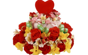 Cake with roses, daffodils and flowers of Alstroemeria on a white background with a red heart