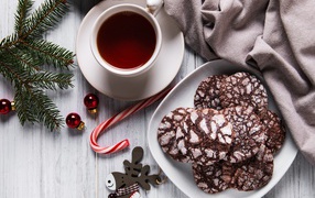 Christmas cookies on a table with tea