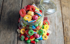 Glass jar with multi-colored jelly candies