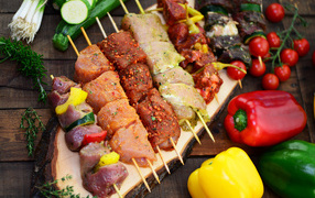 Kebabs on the table with vegetables