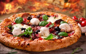 Appetizing pizza with sausage, bacon and mushrooms