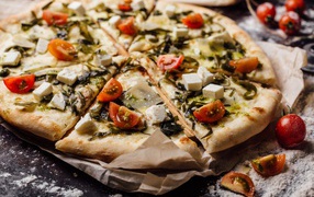Appetizing pizza with sea cabbage, tomatoes and cheese