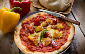 Pizza with bell pepper and cheese on the table