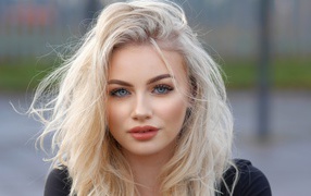 Beautiful blue-eyed blonde face close-up