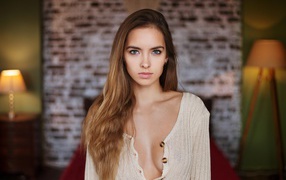 Beautiful young tender girl in a white sweater