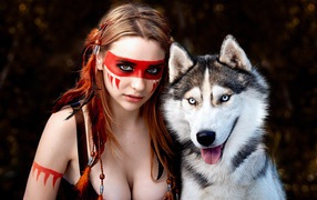Девушка с макияжем индейца с собакой породы хаски