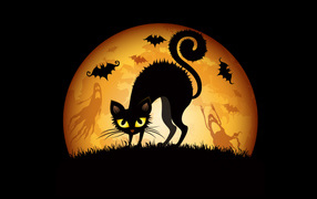 Black cat on the background of a big yellow moon on Halloween