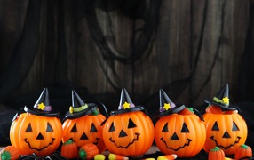 Funny halloween pumpkins in black hats