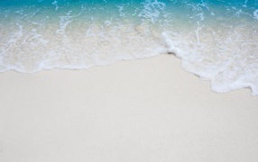 Clear sea water on white sand in summer