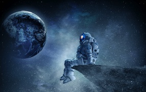 Мужчина астронавт смотрит на планету земля из космоса 