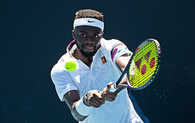 American professional tennis player Francis Tiafu with a racket on the court
