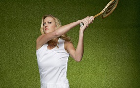 Czech tennis player Petra Kvitova with a racket on a green background