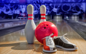 Two bowling pins, bowling ball and sneakers