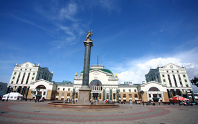 Monument in front of the railway station under a beautiful blue sky, Krasnoyarsk. Russia