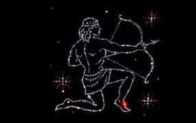 Блестящий знак зодиака стрелец на черном фоне