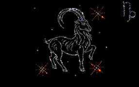 Блестящий знак зодиака козерог  на черном фоне