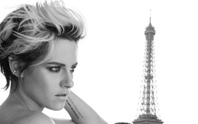 Actress Kristen Stewart on the background of the Eiffel Tower black and white photo