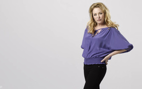 American actress Virginia Madsen on a gray background