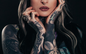 Beautiful tattoos on the hands of a girl