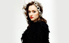 Bright girl, actress Kat Dennings with chains on his head