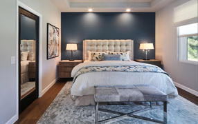 Gray bedroom with king size bed.