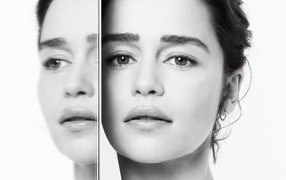 The face of actress Emilia Clark is reflected in the mirror