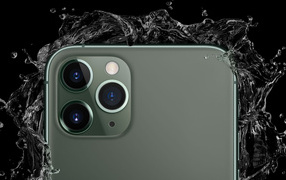 Three cameras of the new iPhone 11 Pro in drops of water