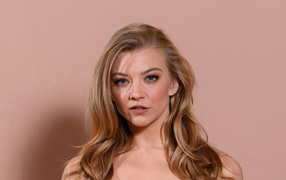 Young blonde actress Natalie Dormer on a pink background