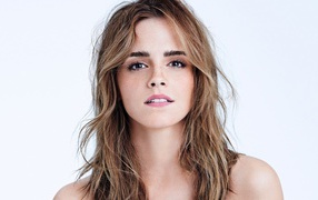 Young girl, actress Emma Watson close up on a white background