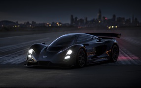 Черный гоночный автомобиль Czinger 21C Lightweight Track 2020 года на трассе