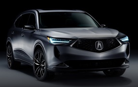 Серебристый автомобиль Acura MDX Prototype 2020 года на черном фоне