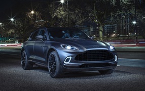 2020 Aston Martin DBX Q Concept car with headlights on in the evening