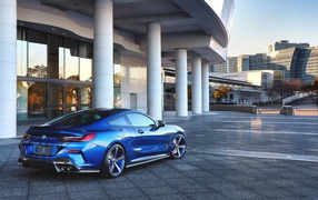2020 blue car BMW M850i XDrive Coupe near the building rear view