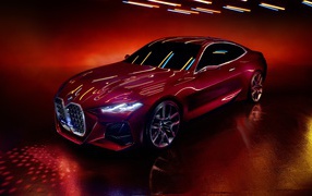 Красный автомобиль BMW Concept 4 2019 года на красном фоне