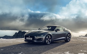 Car Jaguar F-Type P300 Coupe First Edition 2020 on a background of clouds