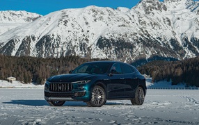 Expensive car Maserati Levante GranLusso Royale 2020 on a background of mountains