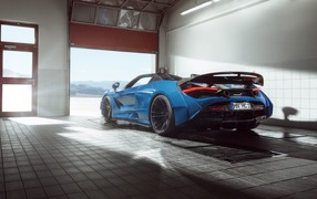 McLaren 720S sports car drives out of garage in 2020